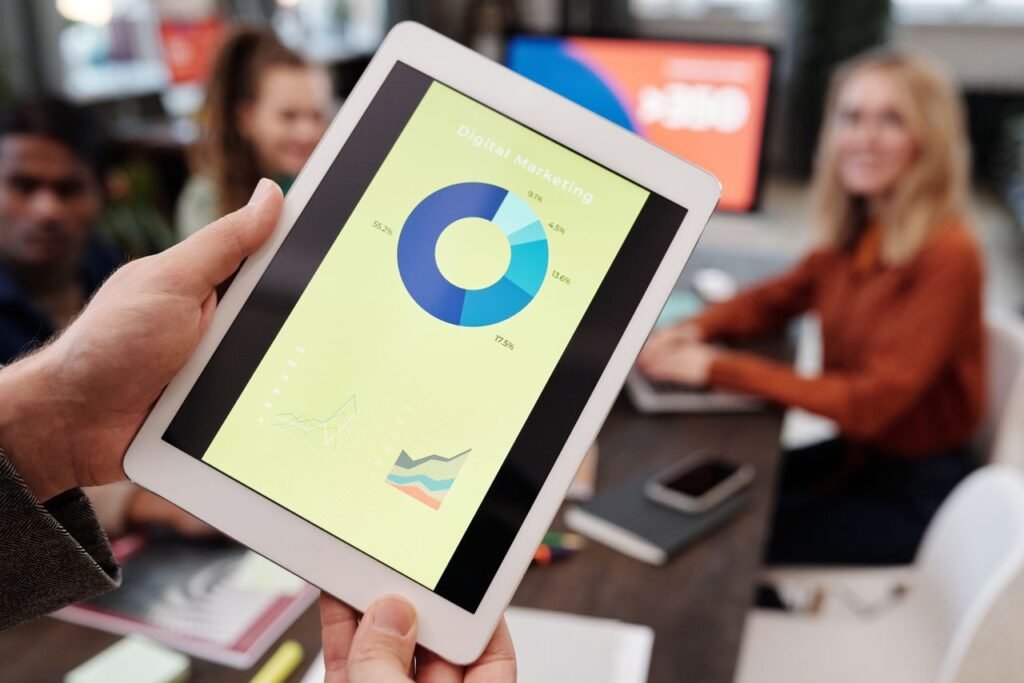 Mastering the First Impression: Your intriguing post title goes here Business team reviewing digital marketing statistics on a tablet during an indoor meeting.